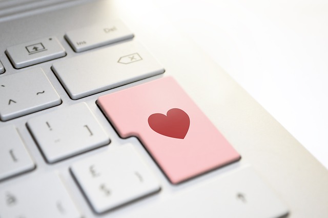 Buttons from a grey keyboard. The "Enter" button is showing as a "Heart Icon" button illustrating sending a romantic message